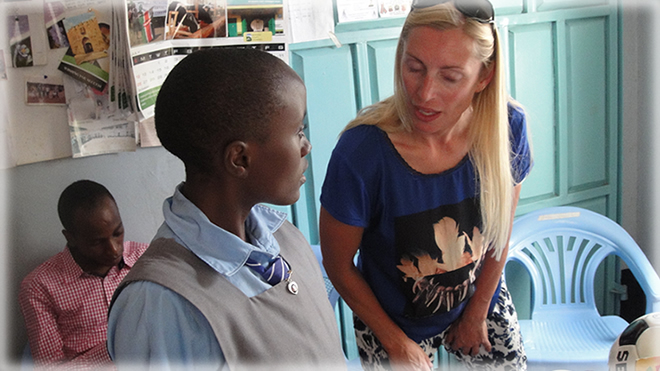 The School president at Murang’a TTC receives from the Danish teachers gifts on behalf of the school